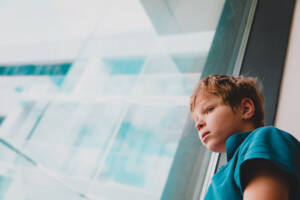 child looking out window
